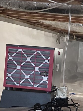 A room featuring a heater and a fan, illustrating a balance of warmth and airflow for comfort.