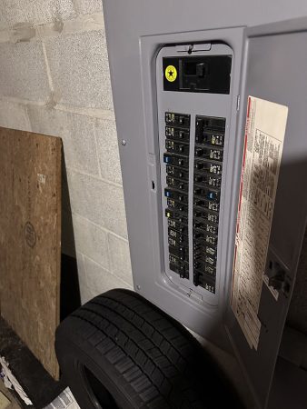 A close-up view of a panel featuring a tire, highlighting its texture and details.